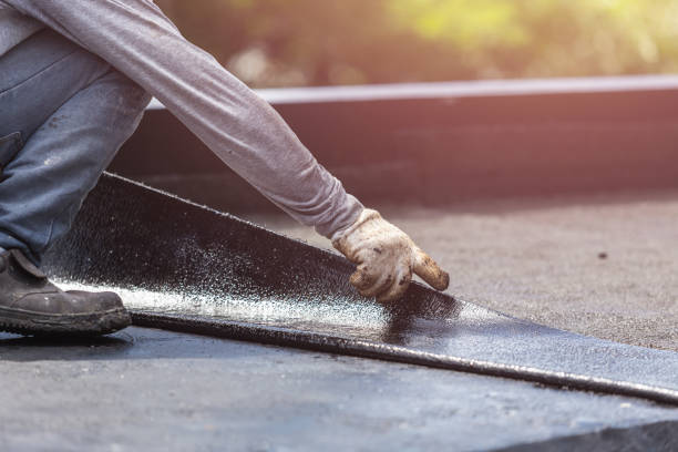 Professional Basement Waterproofing technician working in Helmsburg, IN